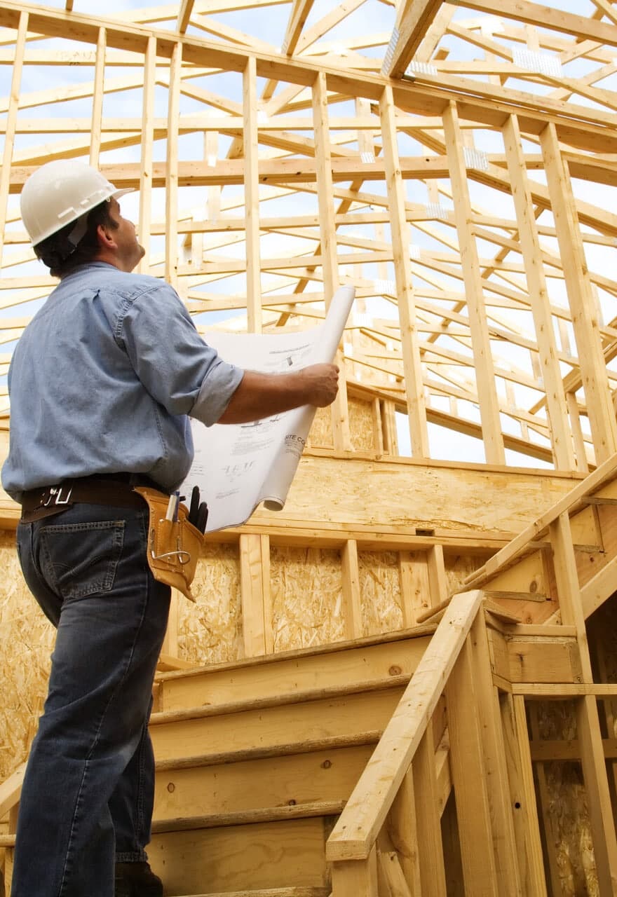 Man looking at construction plans